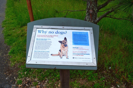 Sign explaining why dogs are not permitted in the nature park - service animals only